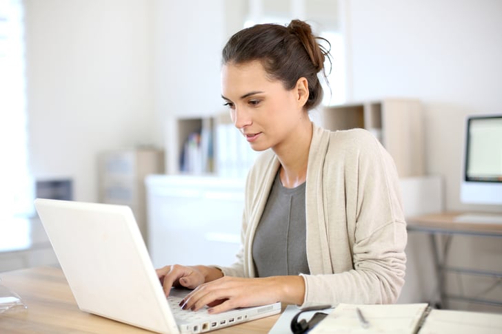 woman working in office on laptop