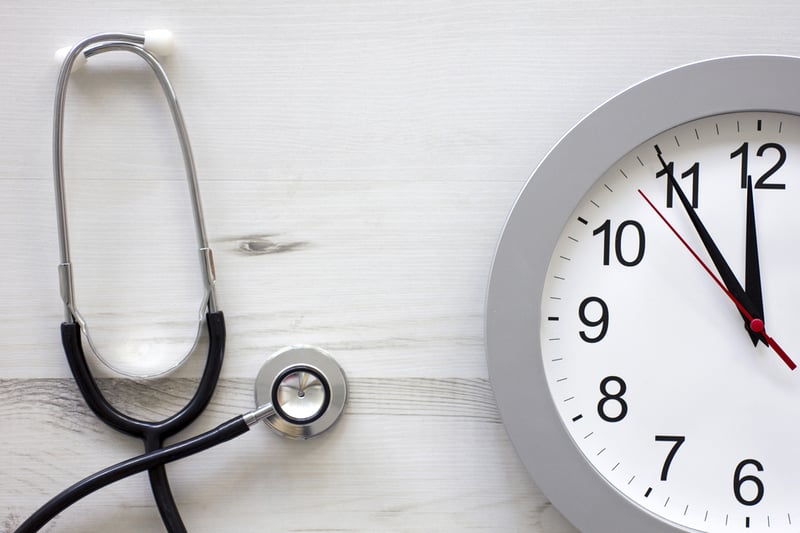 Concept showing doctors stethoscope and a clock face simulating an appointment-1