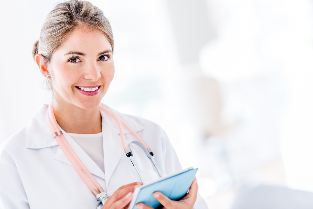 Female doctor using her tablet computer at the hospital-1