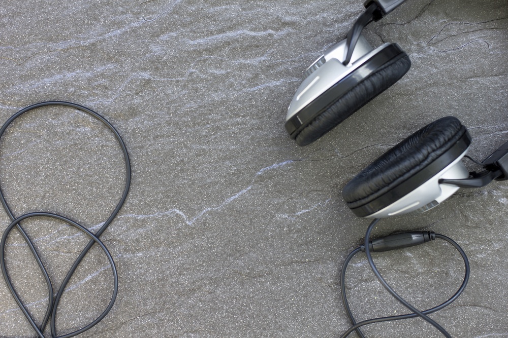 Music headphones on a detailed stone surface-1
