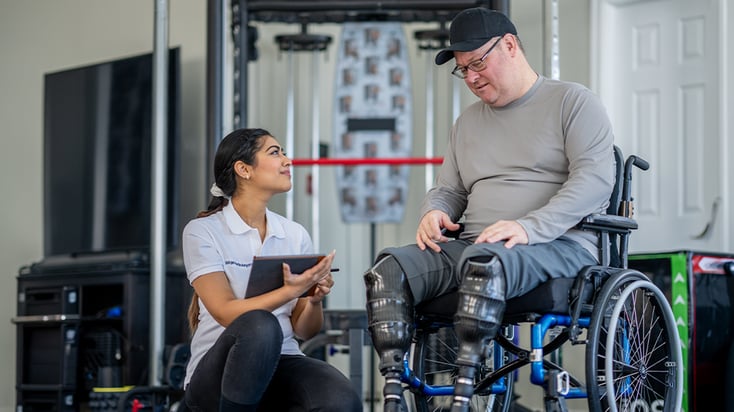Therapist uses tablet as an example of the Expanse Outpatient Therapy solution