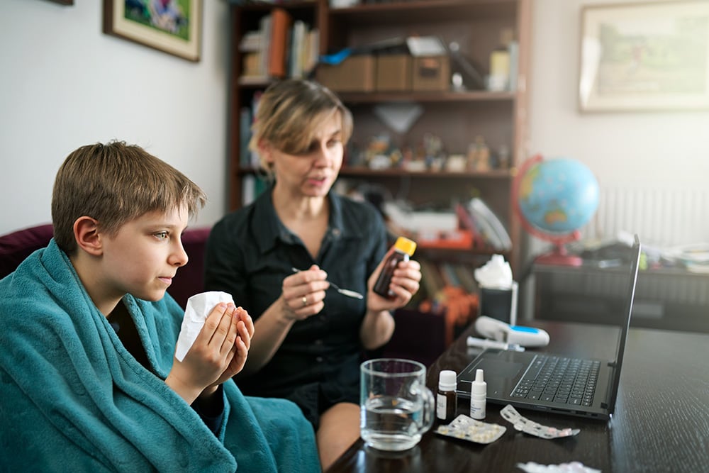 mother-and-son-talking-to-care-provider-on-laptop